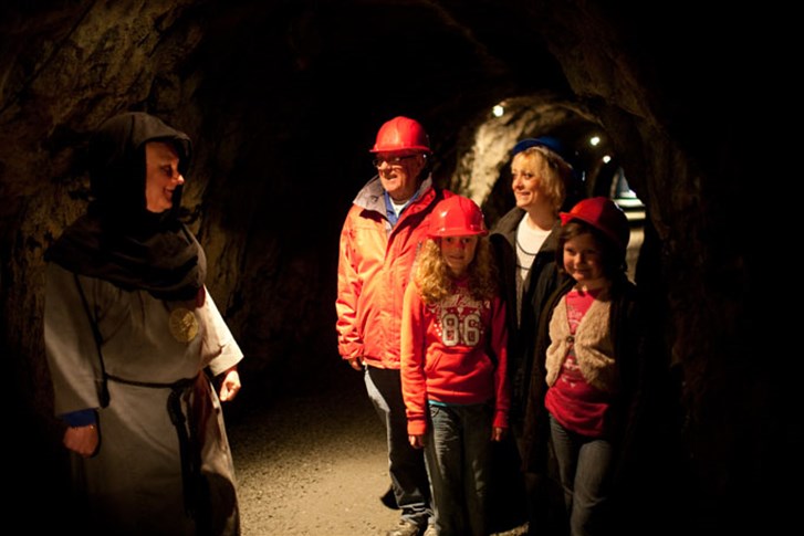 A UK attractions family wrapped up warm in King Arthur's Labyrinth